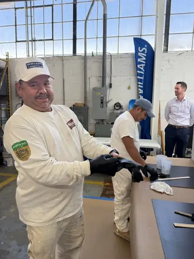 Painter practicing techniques at the Sherwin-Williams training center